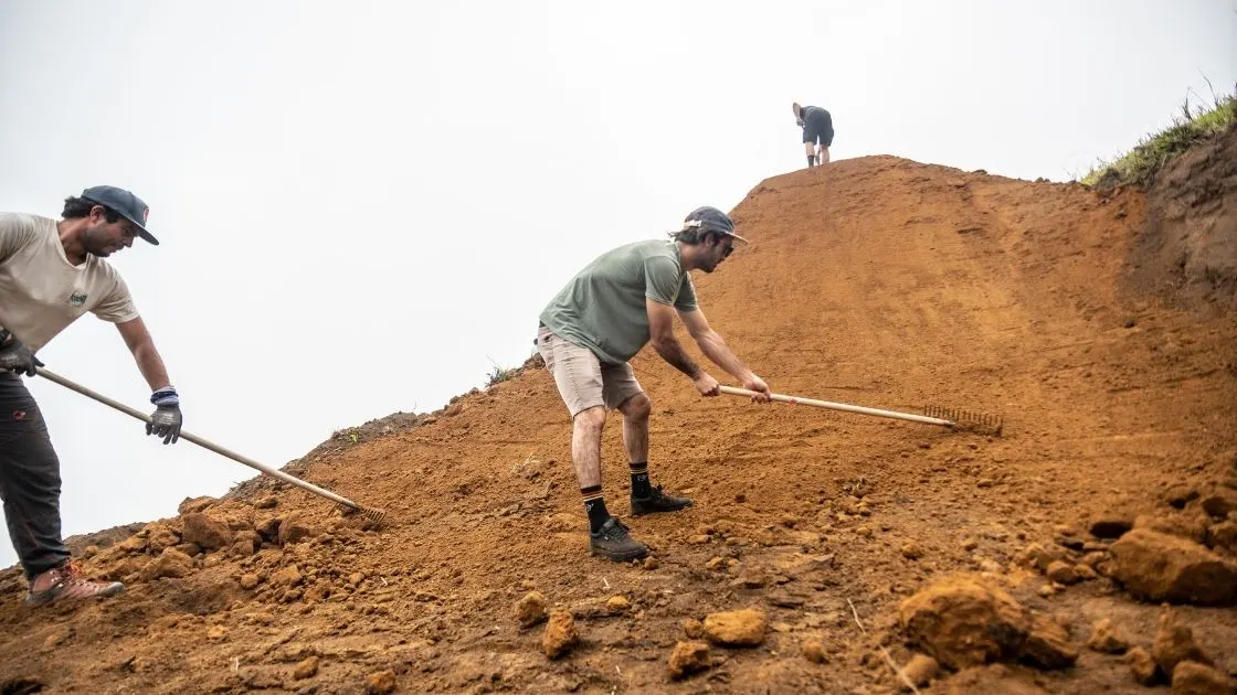 Trail crew digging new singletrack by hand