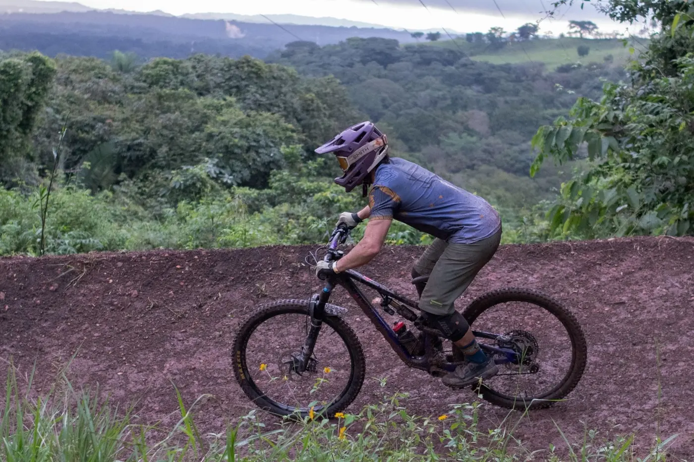 Rider on an open ridge above the rainforest valley