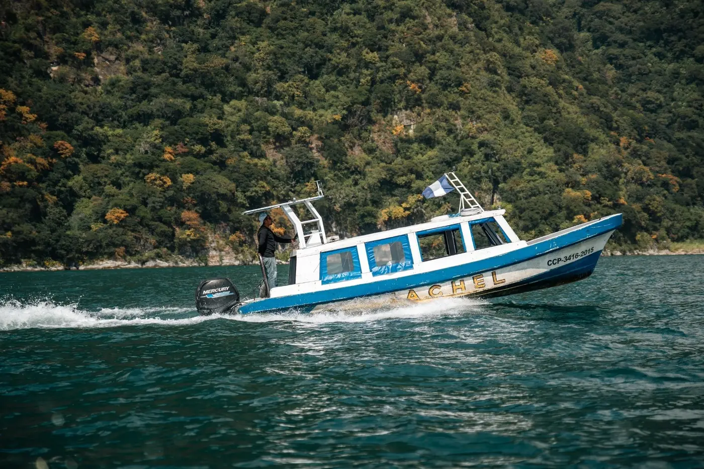 A launch crossing Lake Atitlan