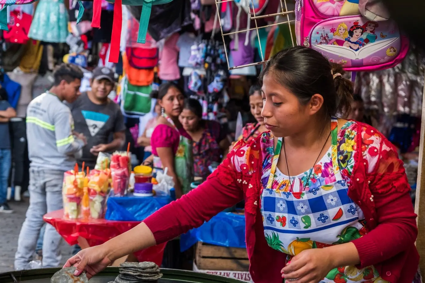 A vendor at a Guatemalan market stall