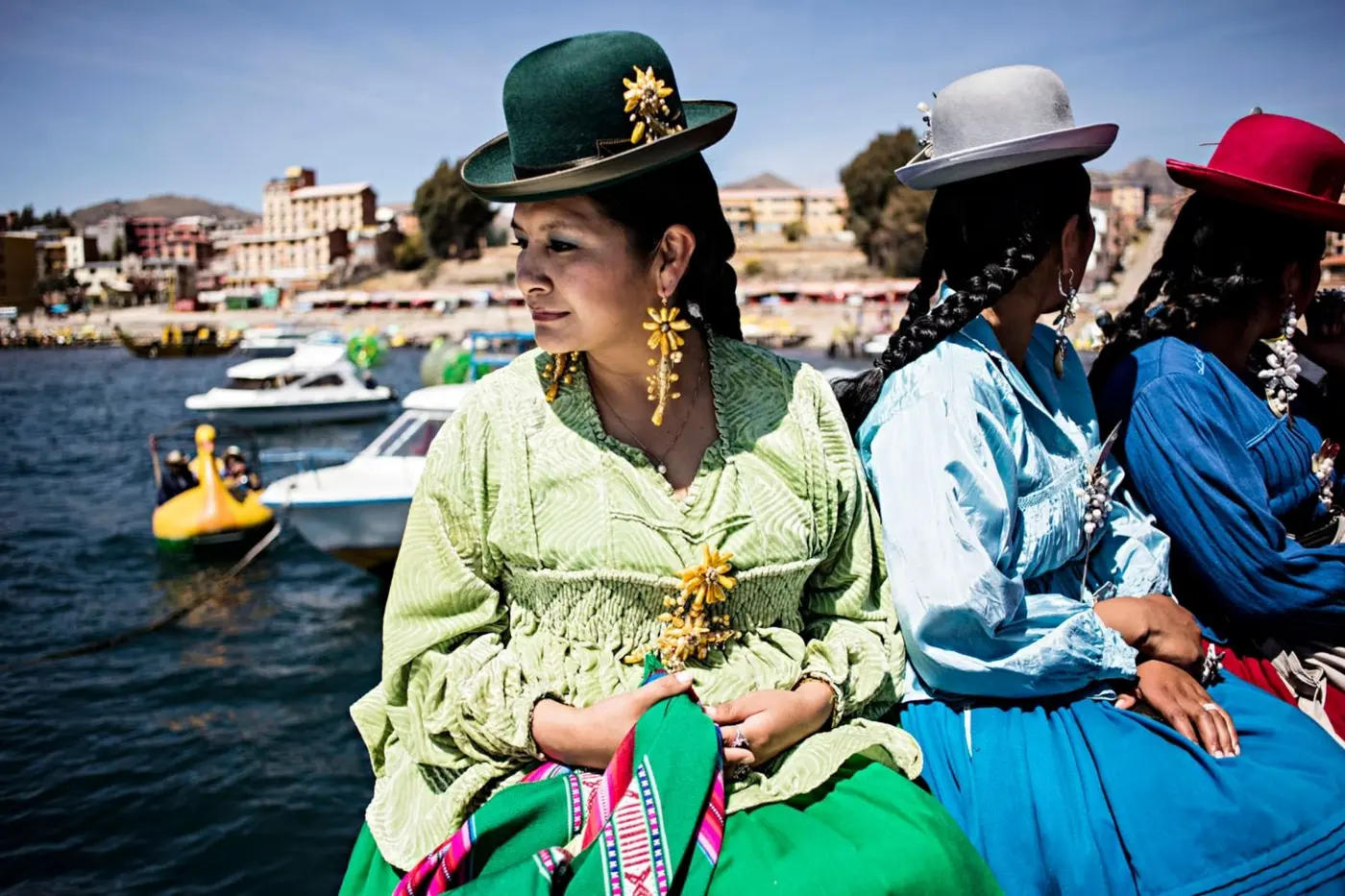 Women in traditional dress crossing Lake Titicaca