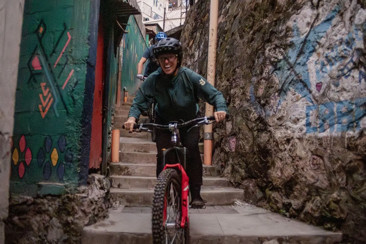 Rider riding a painted village stairway in Guatemala
