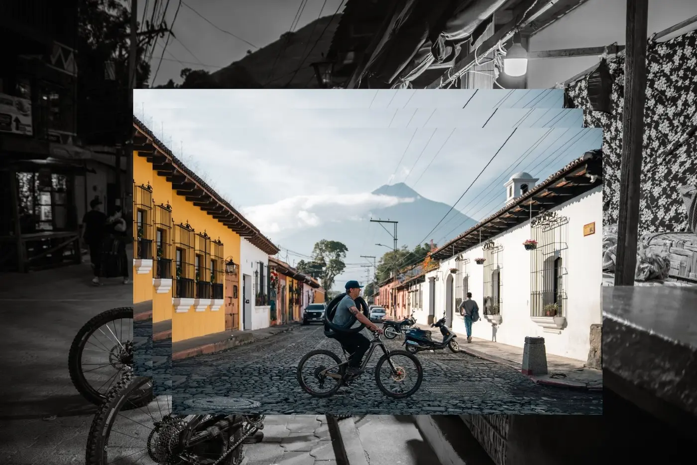 Rider on the cobbled streets of Antigua with a volcano behind